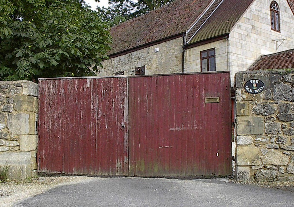 Weathered-and-battered-wooden-gate-ready-for-replacing